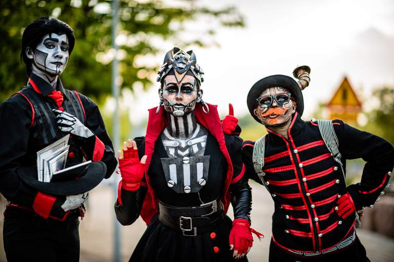 Three people wearing cosplay costumes.