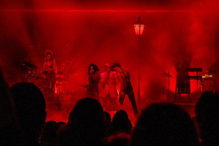 The group Fever Ray performing on a stage.