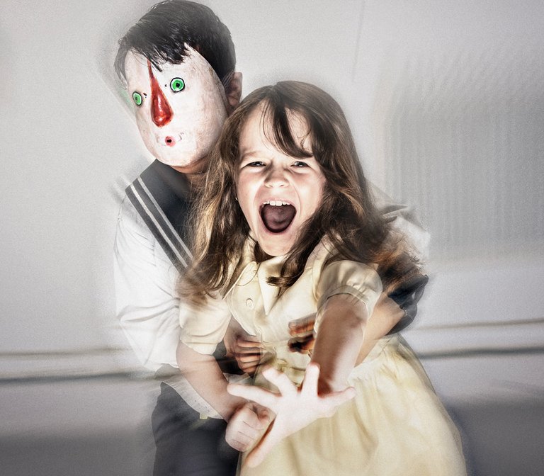 a child in a mask and a screaming girl