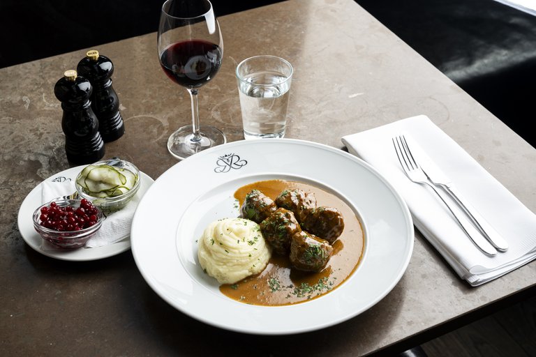 A plate of typical Swedish meatballs with mashed potatoes, served at classic restaurant Riche.