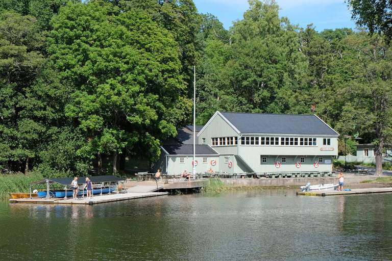 The boathouse and people on a pier.