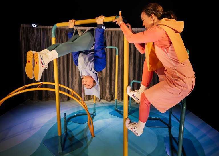 two people on a climbing frame