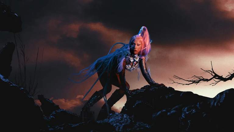 Lady Gaga in a dramatic landscape.