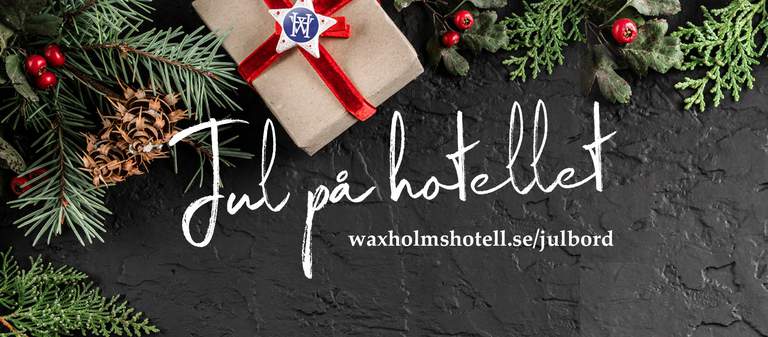 The text "Jul på hotellet", some Christmas decorations and a Christmas present.