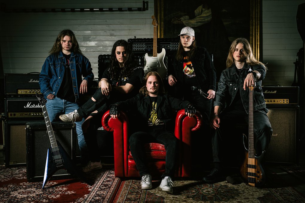 The members of Xion in a music studio.